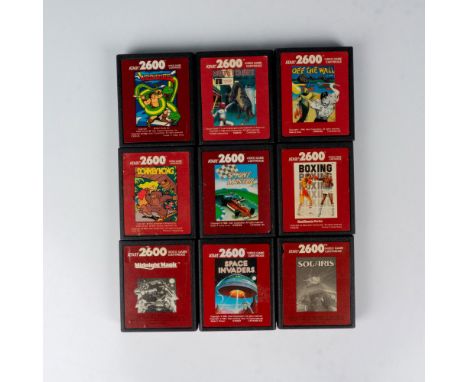 A collection of vintage video games; 2 in black and white pictures cartridges, and 7 color pictures cartridges. Titles includ