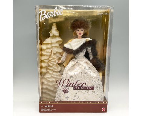 New in Box. This doll is dressed in elegant winter gown with fur edged throw and matching fur hat. Mattel, Inc. backstamp. Th