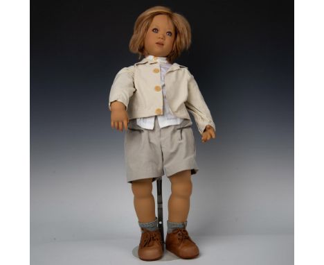 Doll created to match 1960's version of a German boy. Detailed recreation includes his human blonde hair, blue eyes, dress of