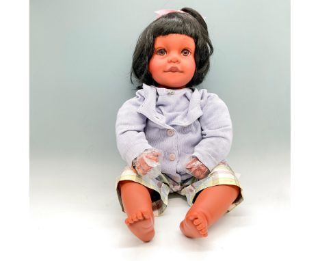 This life-sized vinyl doll with black hair, dark skin dressed in Baby Gap lavender colored day outfit. Pat Secrist impressed 