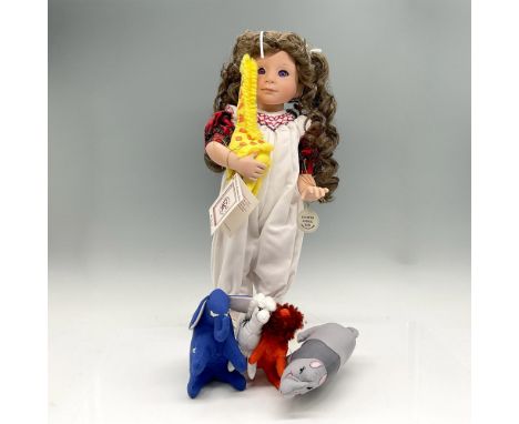 New in Original packaging. Vinyl doll designed as little girl with long curly hair put in pigtails, dressed in white jumper w