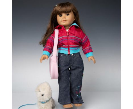 Doll wearing jeans, white shirt and red jacket. Includes pajamas, fuzzy slippers, white jacket, pink top, two pairs of shoes,