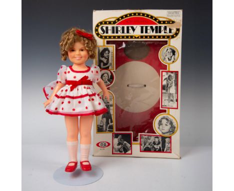 Classic Shirley Temple with her curly hair, bright smile, red and white polka dot dress and red slipper shoes. Ideal Toy tag.