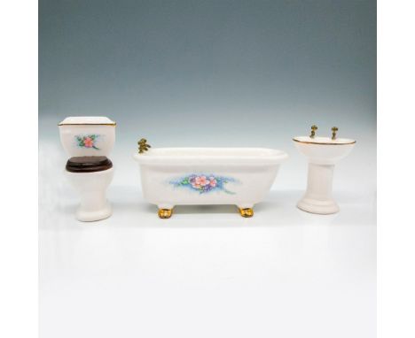 Includes white gilt footed tub with floral design on side; pedestal sink with floral design in bowl and gilt edge; toilet wit