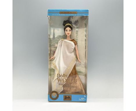 Barbie in stunning gold and white mesh dress; All gold accent. This item has its original box which measures 6"L x 3"W x 13.7