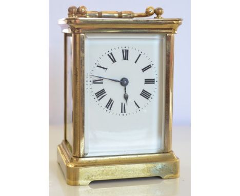 Small lacquered brass French carriage clock, white enamel dial, platform escapement, 12cm and a brown leather carriage clock 