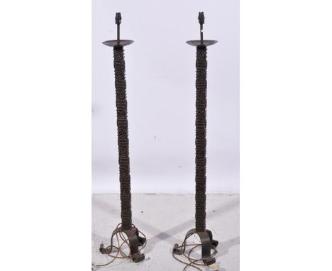 Pair of wrought iron standard lamps, tripod bases, 130cm overall.