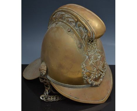 Old brass firemans helmet, and a brass mounted copper bugle by Butler, London and Dublin (2).