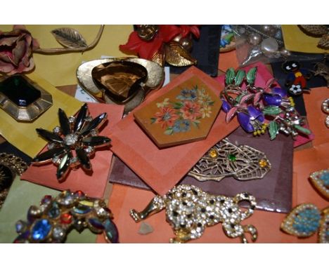 Large collection of brooches, ceramic floral jewellery, powder compacts etc (4 boxes).