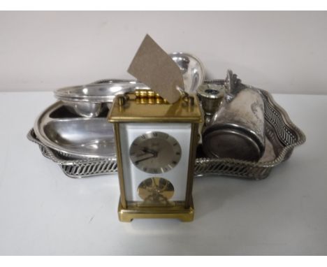 A brass German carriage clock, together with a plated gallery tray, plated candle holders, etc 