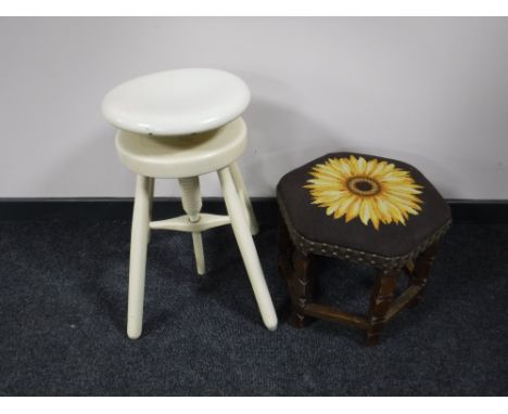 A circular painted adjustable stool together with a hexagonal oak tapestry upholstered stool