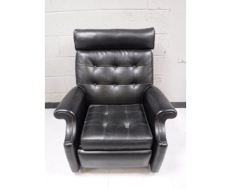 A mid 20th century black button vinyl reclining chair