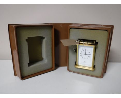 A boxed Norman Mathew carriage clock with key 