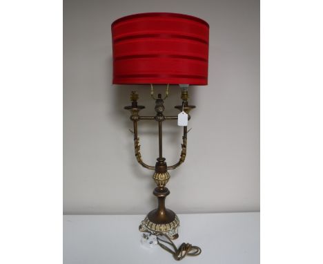 A contemporary gilt two way table lamp with shade 