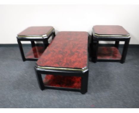 An Oriental style two tier coffee table together with a pair of matching lamp tables