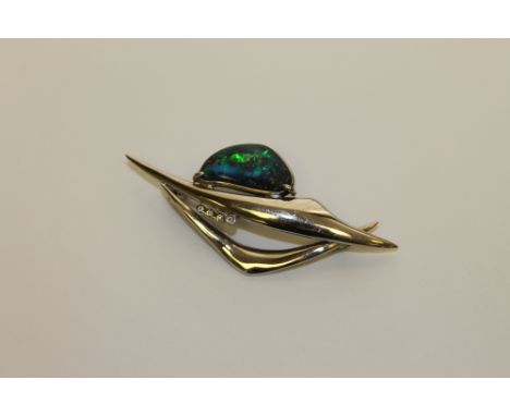 An 18ct white gold opal and diamond brooch, 9.3g