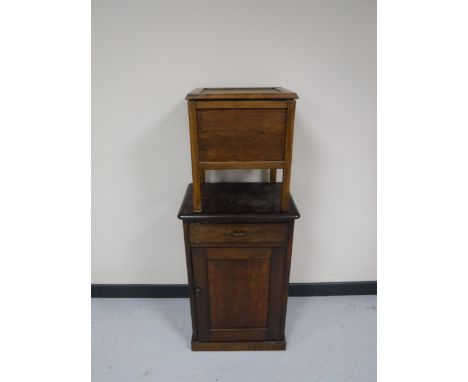An oak cabinet and a commode stool 