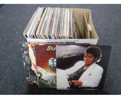 A box containing LP's including easy listening, Michael Jackson, Wings etc