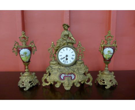 A gilt metal clock garniture