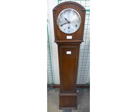 An oak dwarf longcase clock