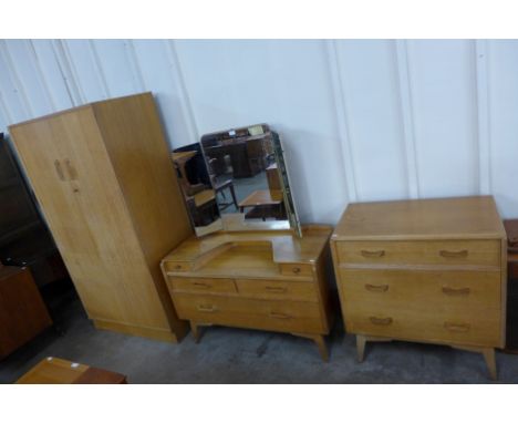 A G-Plan E. Gomme light oak three piece bedroom suite