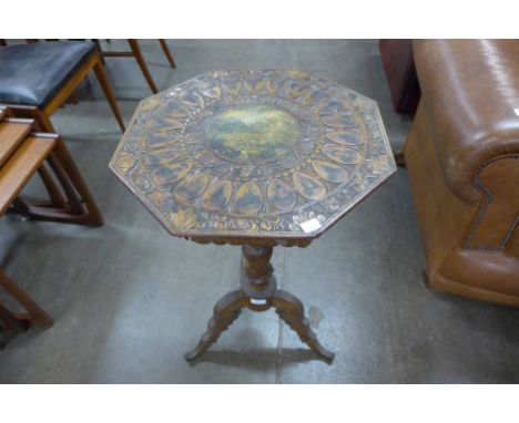 A 19th Century Austrian carved walnut tripod table with painted decorated top