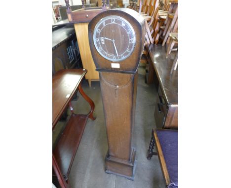 An oak dwarf longcase clock