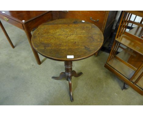 A Victorian oak circular tripod table