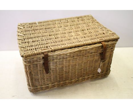 Early 20th century wicker hamper with liftable lid and strap closure, H 46cm, W 82cm