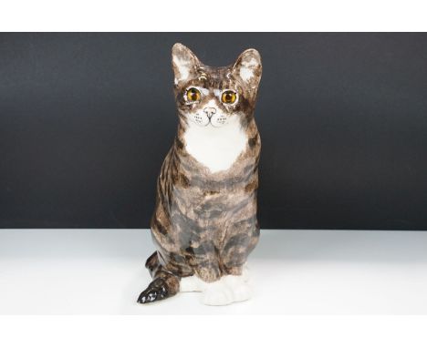 Large Winstanley pottery model of a tabby cat with glass eyes, H 34cm, hand signed and marked England 7 to base