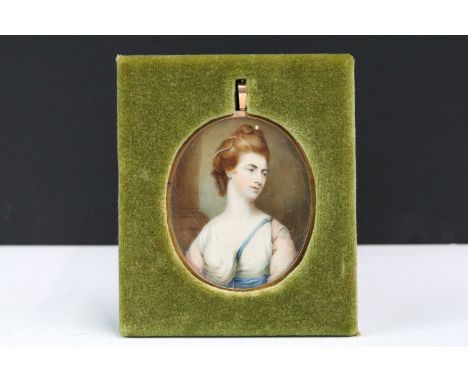 19th century English school, head and shoulders portrait of a lady, watercolour, set in yellow metal oval frame with blue gui