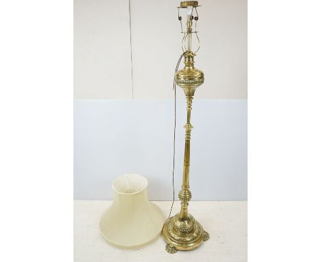 Late 19th Century ornate brass standard lamp, with gas burner fitting, converted for electricity, with shade, 172cm high (exc