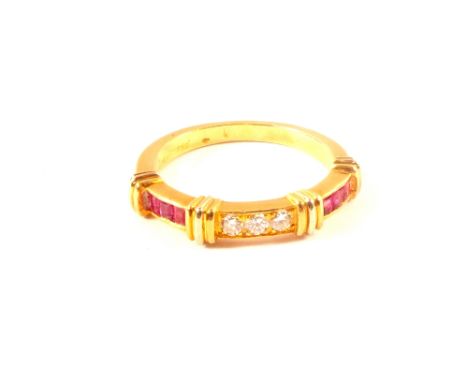 An 18ct gold ruby and diamond ring, size M