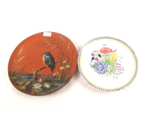A Wedgwood terracotta plate painted with a kingfisher and a Poole floral plate