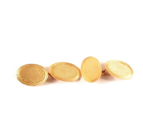 A pair of 9ct gold engine turned cufflinks