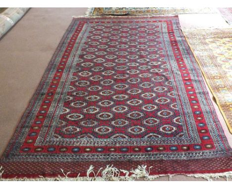 An Afghan carpet, 114" x 74"