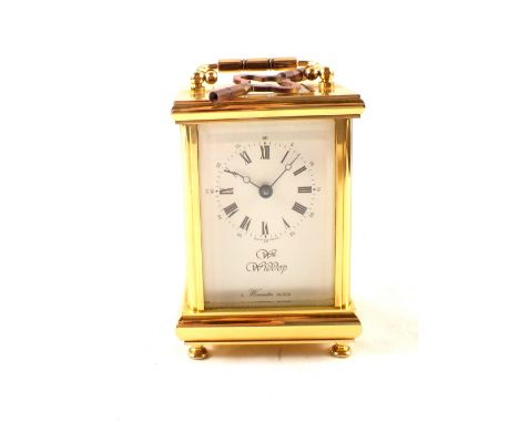 A brass carriage clock, dial marked Widdup, Worcester