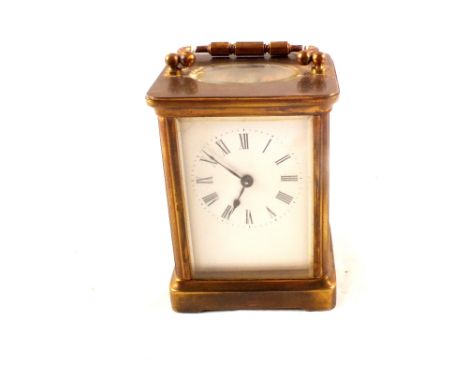 A brass carriage clock marked R & Co Made in Paris