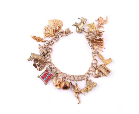 
	
		A CHARM BRACELET 
		The double link bracelet to a concealed clasp stamped 14K, suspending various charms including a Vic