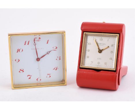 
	
		TIFFANY &amp; CO. 
		A GILT METAL AND RED LEATHER TRAVEL ALARM 8 DAY DESK CLOCK, NO. 1020926
		Movement: Swiss 8 day ala