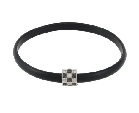 
	
		CHOPARD, A DIAMOND AND BLACK DIAMOND PANEL PENDANT ON A BLACK LEATHER COLLAR 
		The panel clasp with a pav&#233; set che