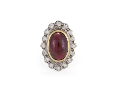 
	
		A GARNET AND DIAMOND CLUSTER RING
		The oval cabochon garnet collet set within a brilliant cut diamond surround, to a po