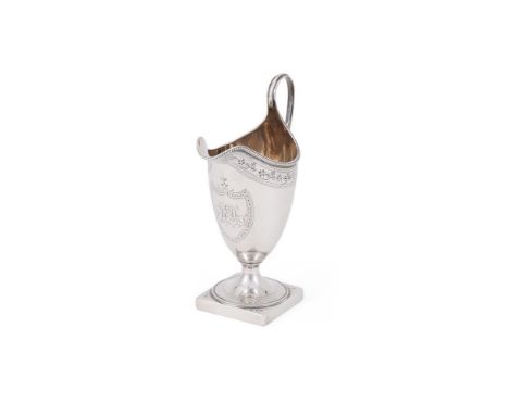 
	
		A GEORGE III SILVER HELMET CREAM JUG
		PETER AND ANN BATEMAN, LONDON 1791
		With a beaded border, high clip handle, engr