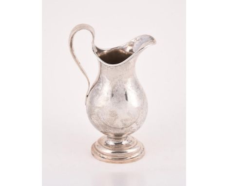 
	
		A SWEDISH SILVER BALUSTER JUG
		STOCKHOLM 1797
		With a reeded scroll handle, engraved with a scroll motif and on an ova