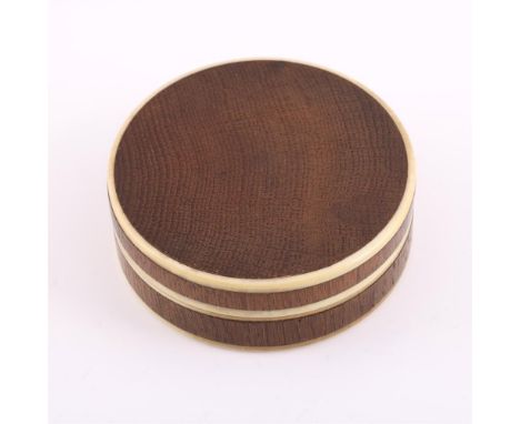 Y&amp;nbspA HARDWOOD AND IVORY CIRCULAR BOX 19TH CENTURY Supposedly made from a piece of the Victory 8cm (3 1/4in) diameter
P