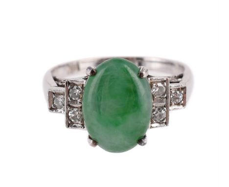 
	
		A JADEITE JADE AND DIAMOND RING 
		The oval cabochon jadeite jade between stepped eight cut diamond set shoulders, the s