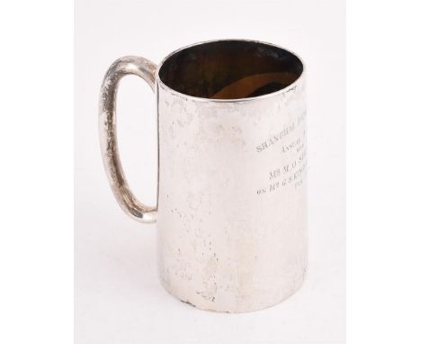 
	
		A CHINESE SILVER TAPERING MUG
		HUNG CHONG &amp; CO., SHANGHAI, CIRCA 1912
		With a loop handle and engraved with a pres