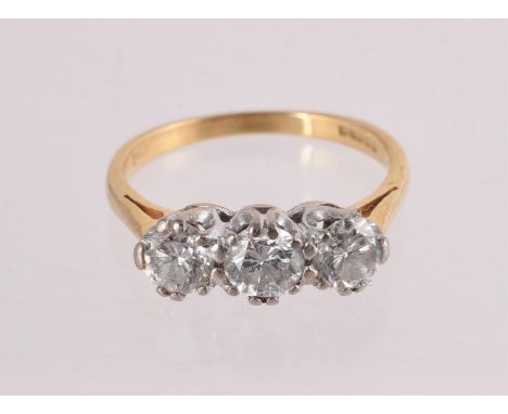 
	
		A DIAMOND THREE STONE RING
		LONDON 1988
		The three graduated brilliant cut diamonds, estimated weight 1.05 carats tota