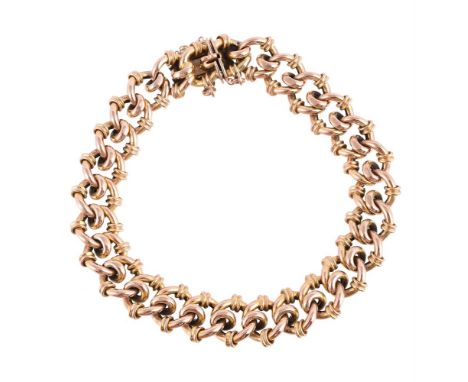 
	
		A LATE VICTORIAN FANCY LINK BRACELET 
		The fancy interlocking links with reeded detail, to a concealed clasp, stamped 9