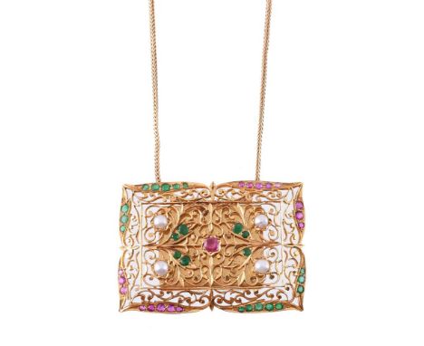 
	
		A GEM SET MINIATURE KORAN CASE PENDANT  
		The pierced scrolling foliate rectangular gold coloured panel with circular c